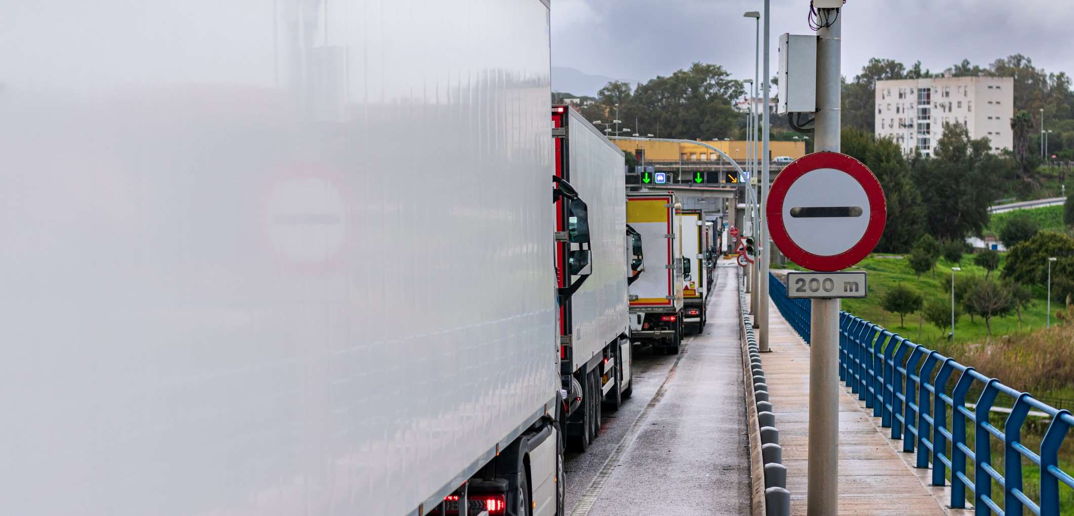 Lorries at border crossing waiting on customs clearance