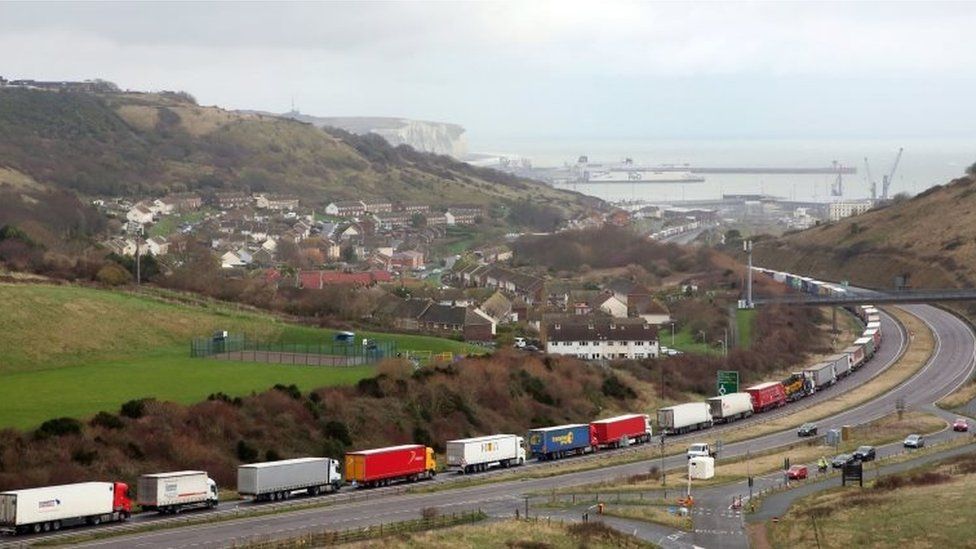 queue of lorries on motorway