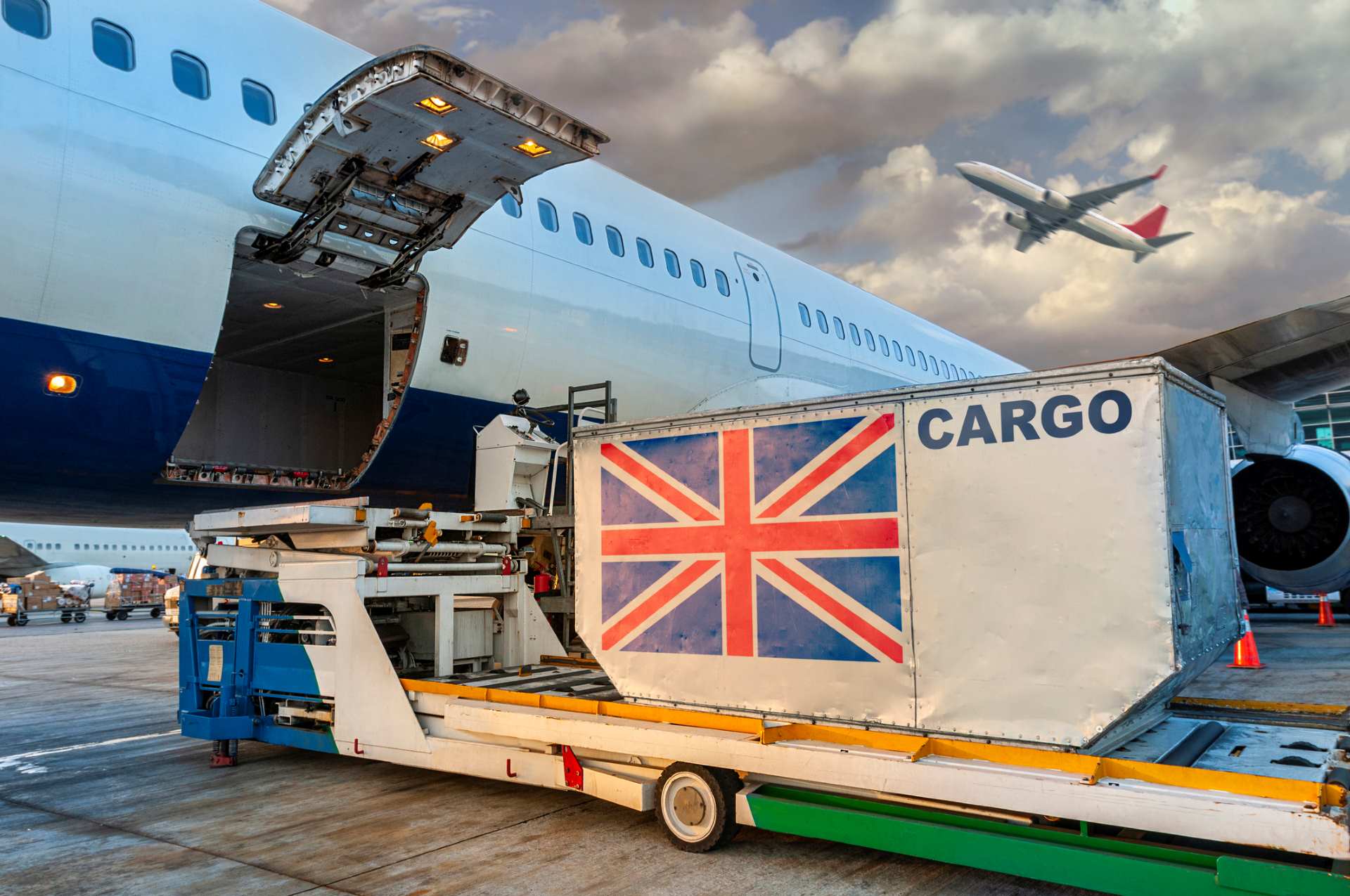 Container with British flag being loaded onto a plane